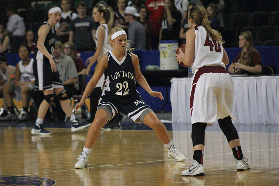 Junior Courtney Carlson plays defense against Salina Central. 