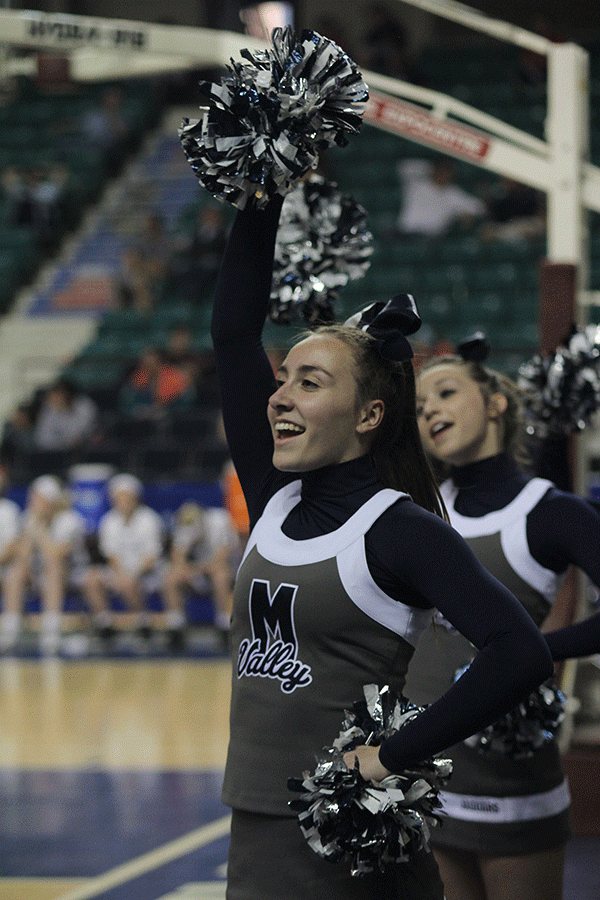 Junior Brooke Carson cheers during the game.