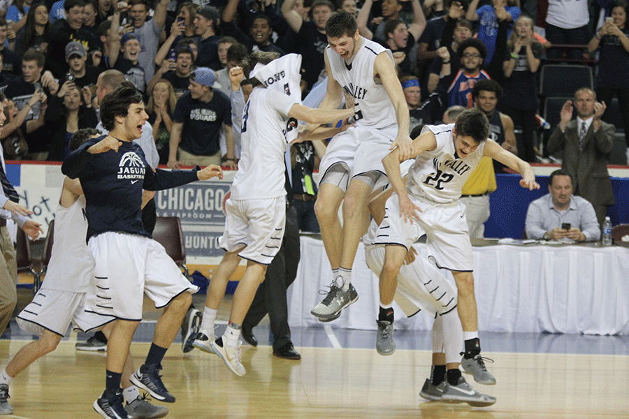Senior Clayton Holmberg jumps in the air to celebrate the win.