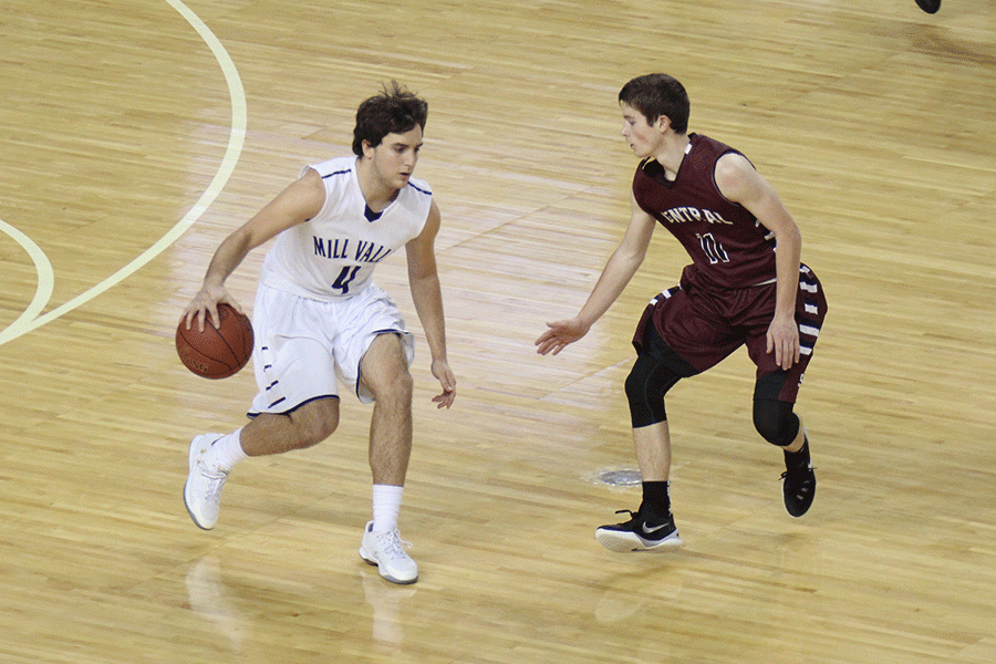 Senior Logan Koch dribbles around his opponent.