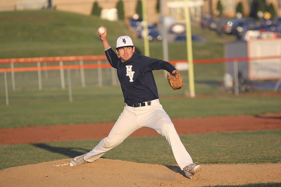 Looking to the batter, senior Jack Nielsen pitches to a Bonner Springs batter on Thurs. March 25. The Jaguars played a double header against the Braves and won both games 6-2 and 15-2.