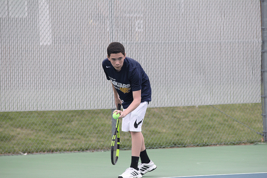 Freshman Eric Schanker prepares to serve the ball.