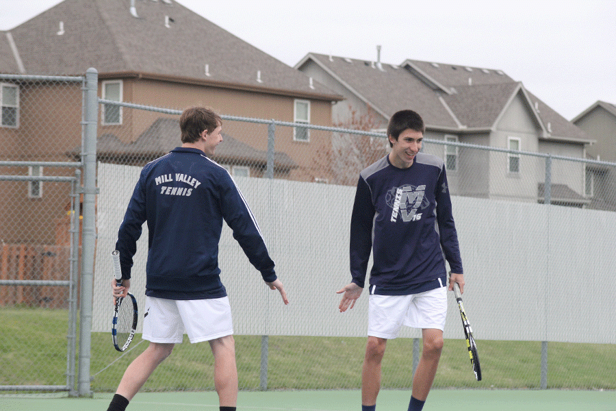 Doubles parters James Bock and Alec Bergeron celebrate a victory after their match. 
