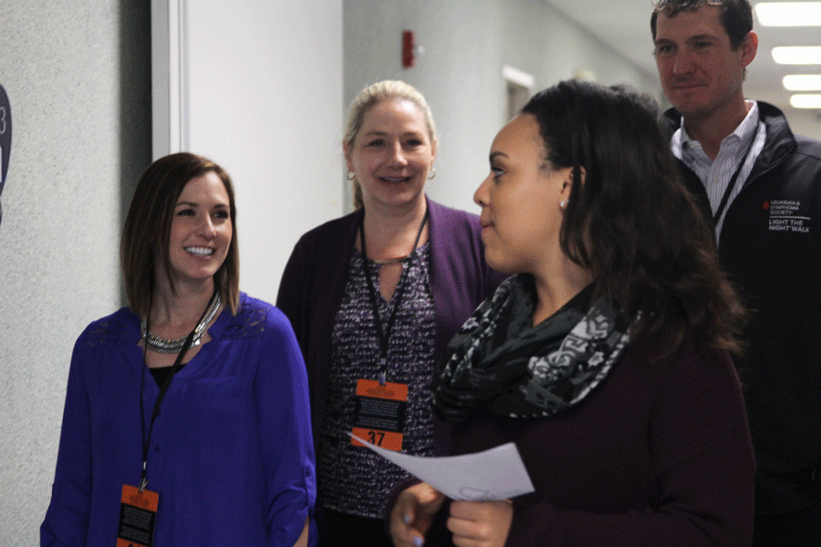 During the Shawnee Leadership Programs Education Day, senior Taylor Pullen gives participants a tour of the school on Thursday, March 24. 