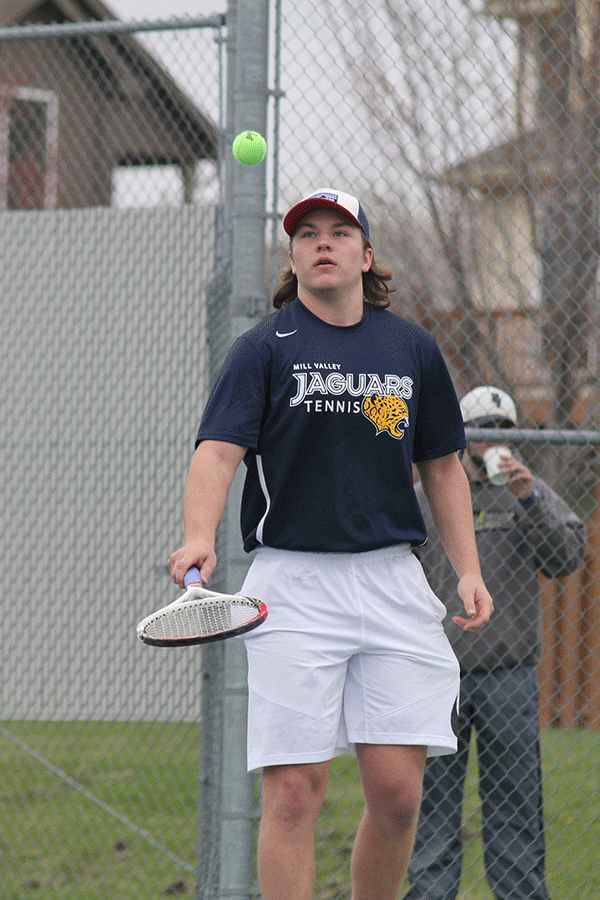 Senior Tyler Shurley bounces the ball on his racquet before beginning his next match.