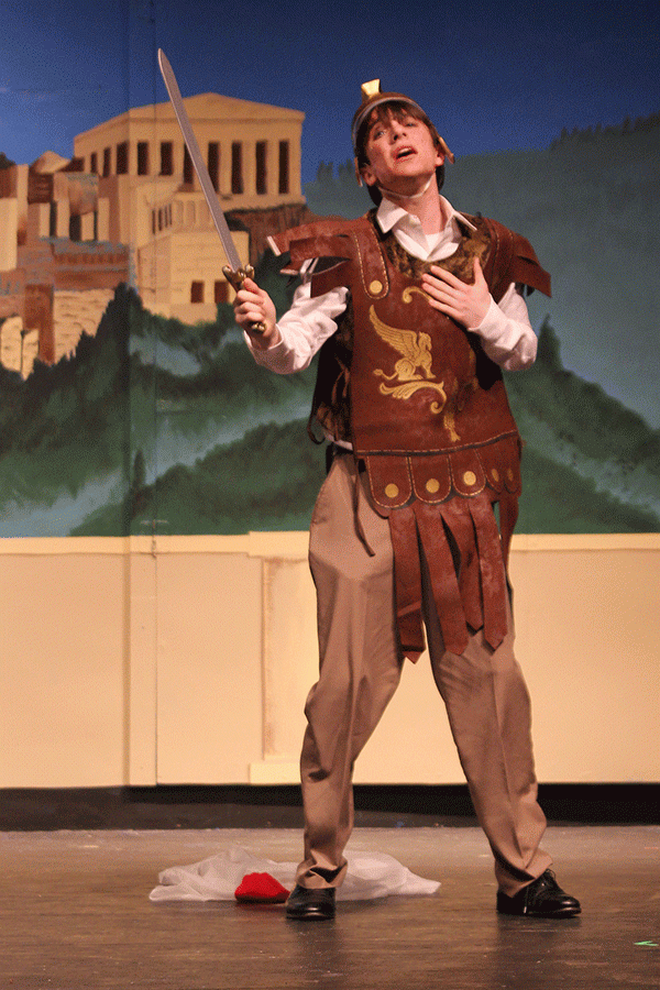 Playing his character Nick Bottom, senior Mason Cooper flourishes his sword in excitement.