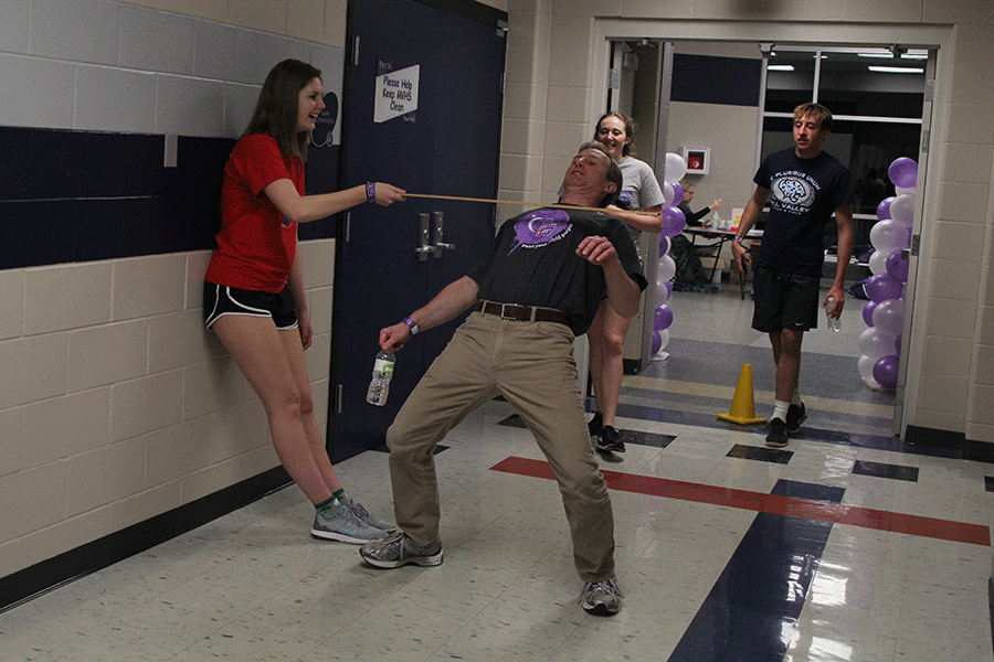 Math teacher Brian Rodkey conquers the limbo walk.