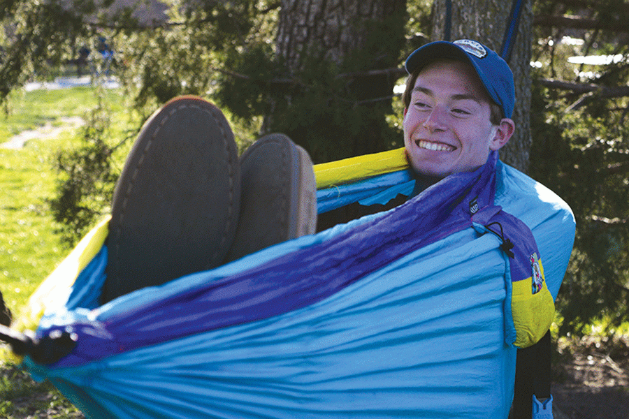 Smiling%2C+senior+Brian+Fitzsimmons+hammocks+at+Garrett+Park+alongside+his+friends+on+Saturday%2C+April+2.+