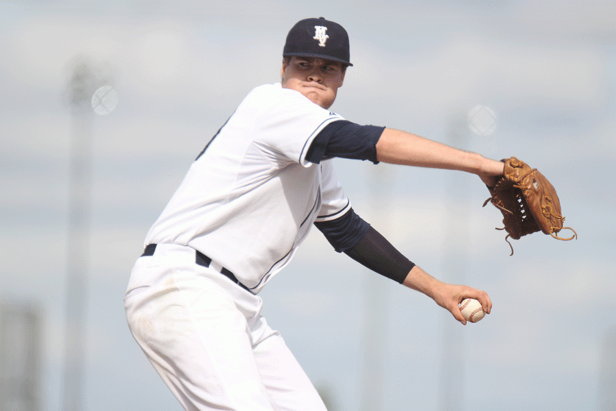 Winding up for a pitch, senior Tyler Grauer prepares to strike out the Turner Bears batter on Thursday, April 29. The Jaguars defeated the Bears in the first game, 10-1, and fell 5-8 in the second.