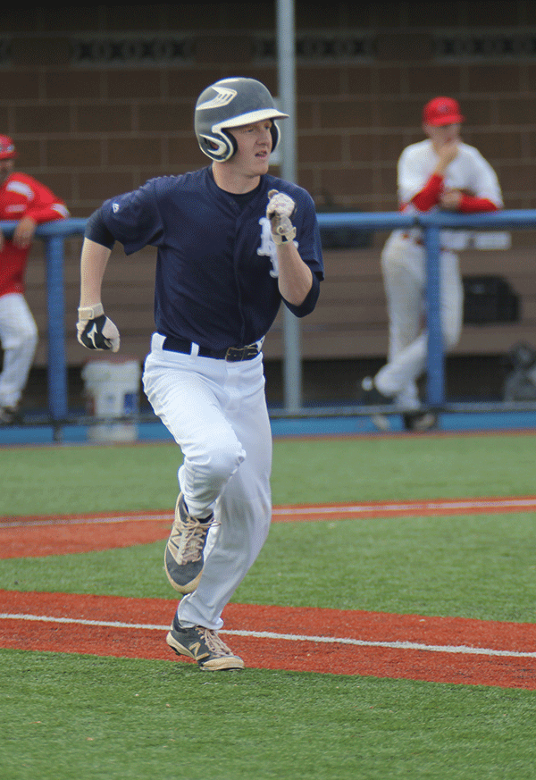 Senior Brenden Shutt runs towards first base.