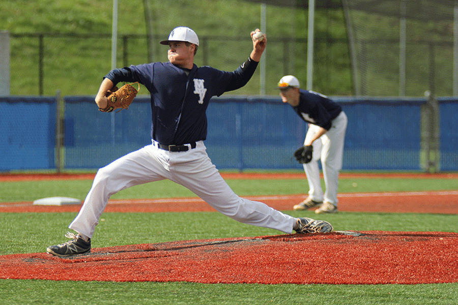 About to pitch the ball, senior pitcher Tyler Grauer puffs up his checks before releasing the ball on Wednesday, April 20.