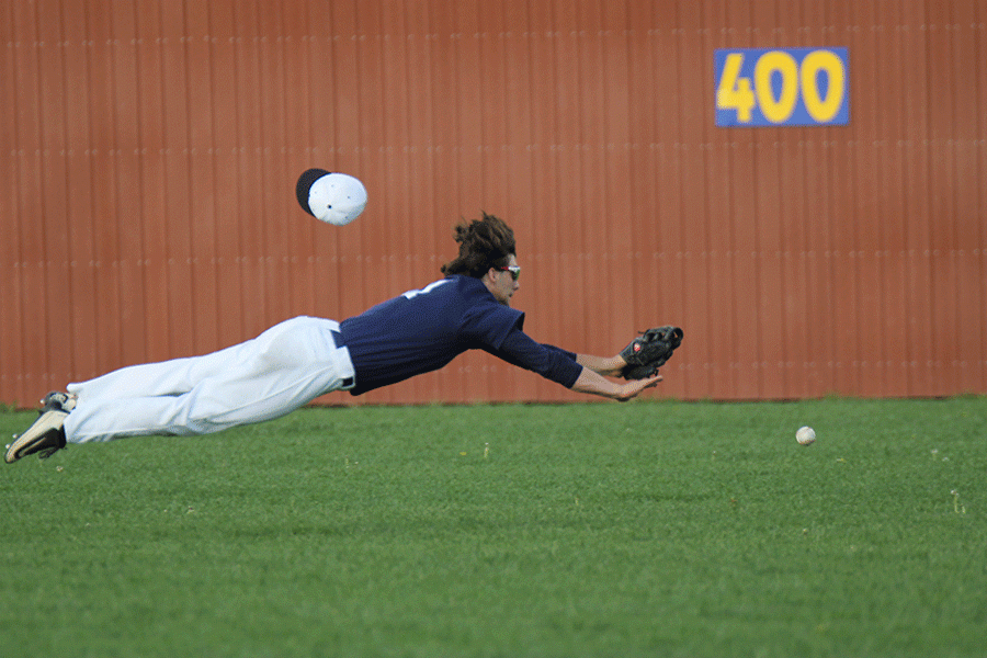 Junior center fielder Luke Sosaya dives for a ground ball. 
