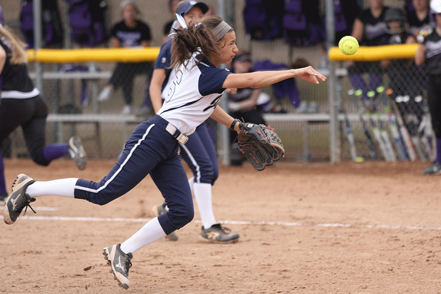 Freshman Macey Gaschler throws the ball towards home plate. The team lost to Piper 4-6 and 3-5. 
