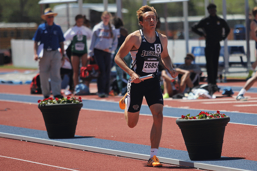 Junior Thomas Hopkins prepares to cross the finish line for the boys 4x800 meter relay on Saturday, April 23.