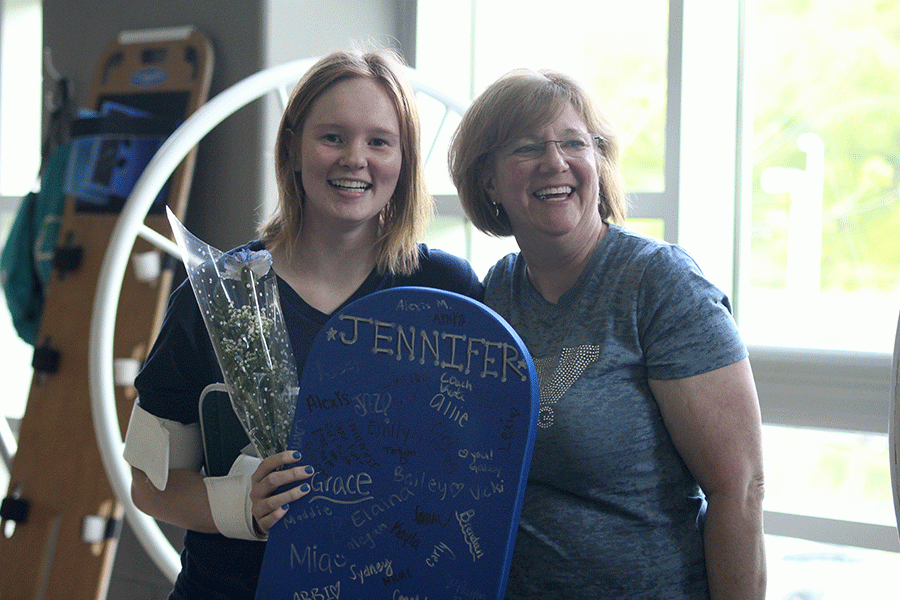 Posing with her mom, senior Jennifer Sims takes part in senior night.