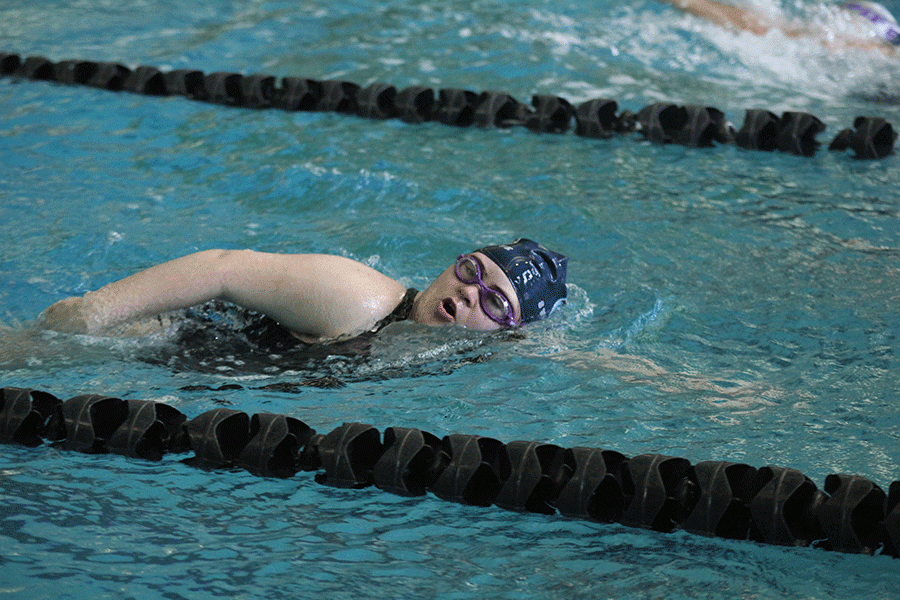 Senior Sara Pietig comes up for a breath as she competes in the 100 yard freestyle