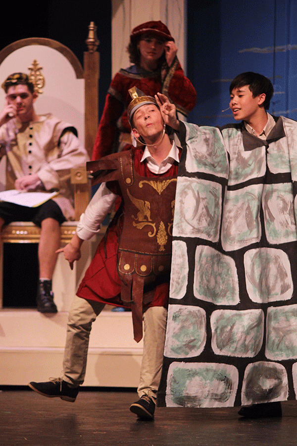 Looking through the chink in the wall, senior Hawkeye Mitchell, as Pyramus, seeks for his true love.