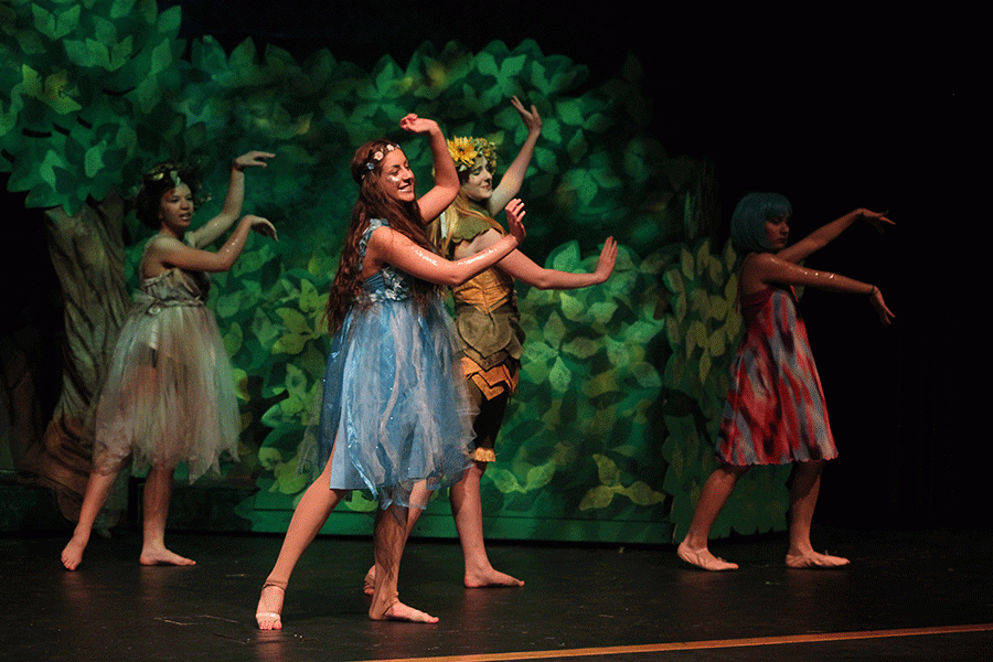 Playing the role of a fairy, junior Kara Mason dances to a lullaby.