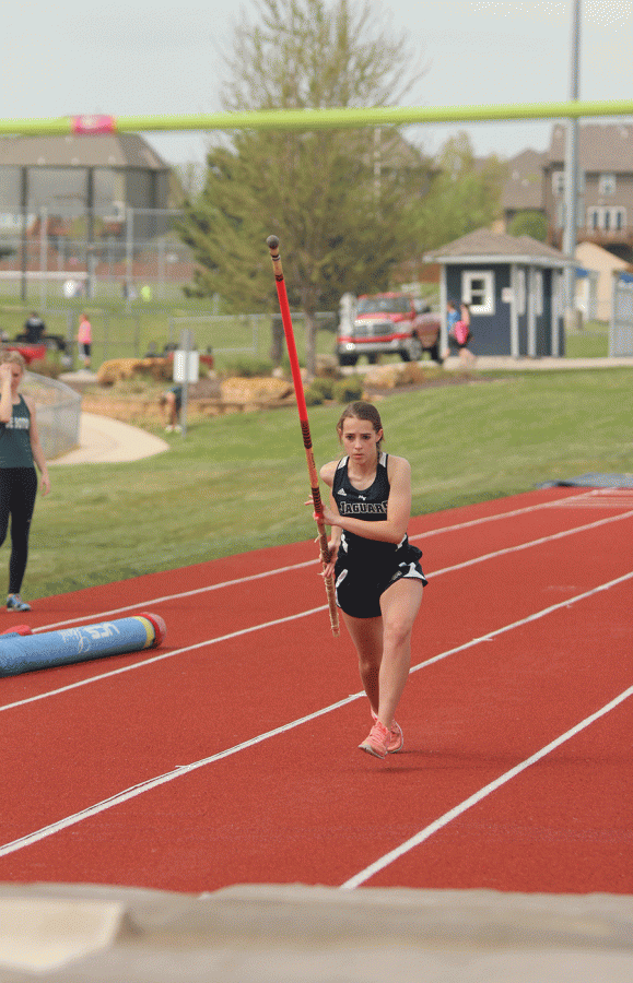 Sophomore Emily Jackson begins running for girls pole vault.