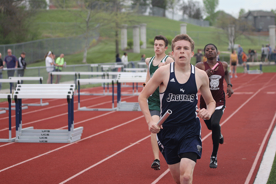 Sophomore Riley Arthur finishes his second lap in the boys 4x800 meter relay on Tuesday, April 19.