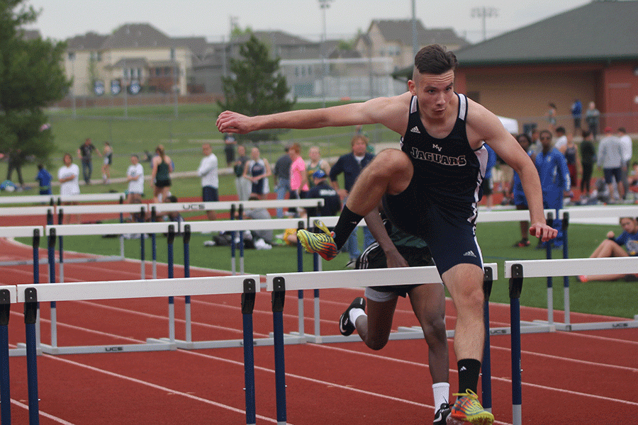 Junior Anthony Meljanac passes a hurdle in the boys 110 meter hurdles.