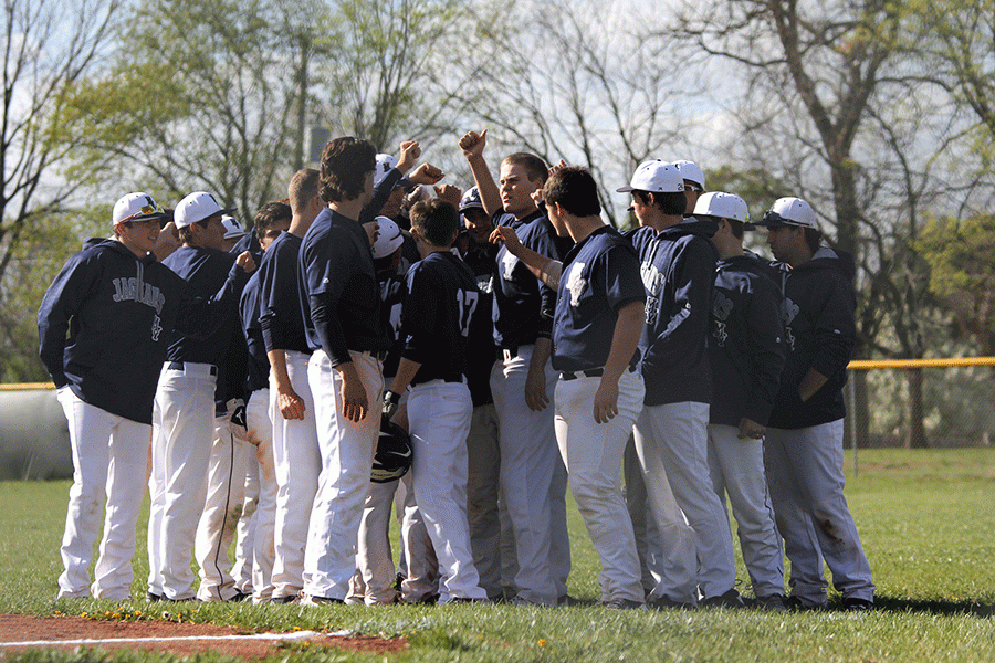 After their loss the team huddles for a pep talk.