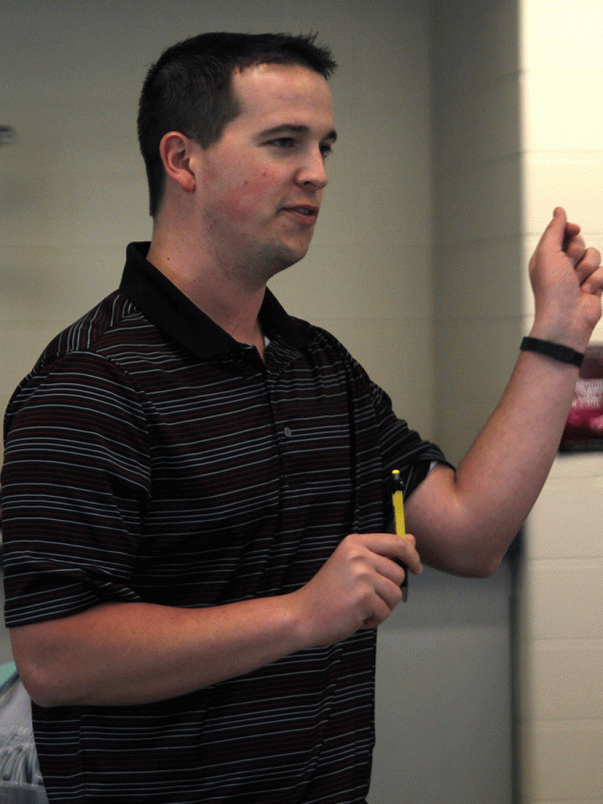 At the beginning of the event help by jagPride, counselor Chris Wallace explains to students how coloring relieves stress.