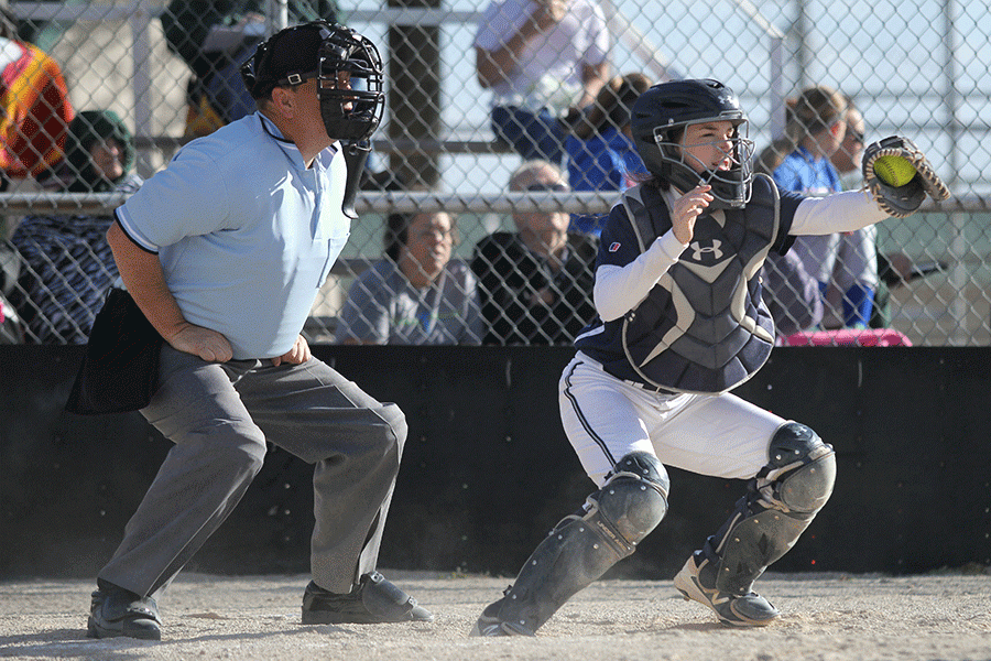 Freshman Grace Lovett catches the ball. In a double header against the Basehor-Linwood Bobcats, the team lost the first game 2-0 and won the second game 8-6 on Thursday, April 7.