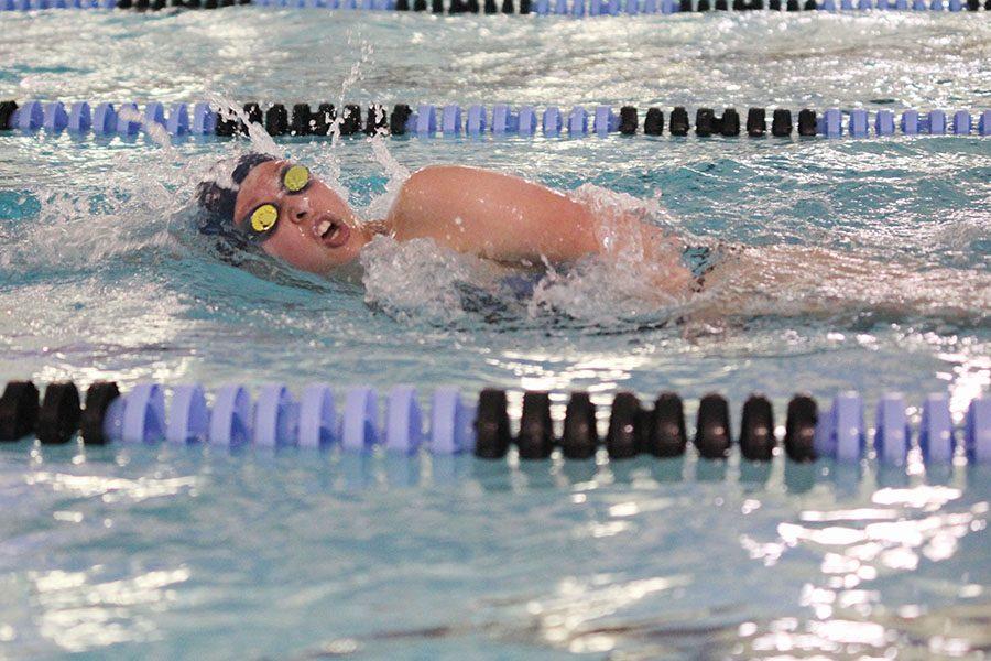 Swimming the freestyle, sophomore Jordan Robinson competes in an invitational at Shawnee Mission East on Saturday, April 23. 