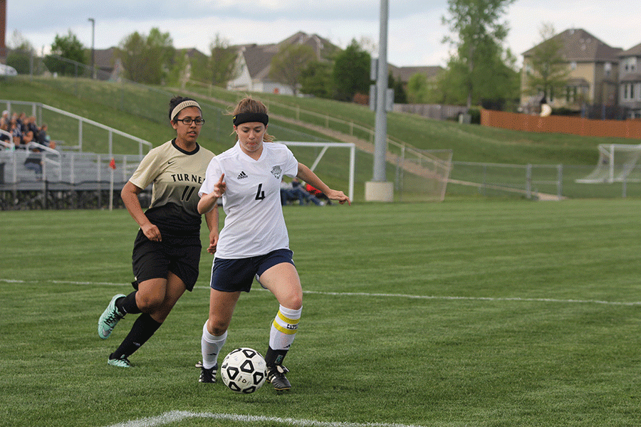 Senior Emma Wetzel approaches the goal with ball in possession. The team beat Turner 10-0.