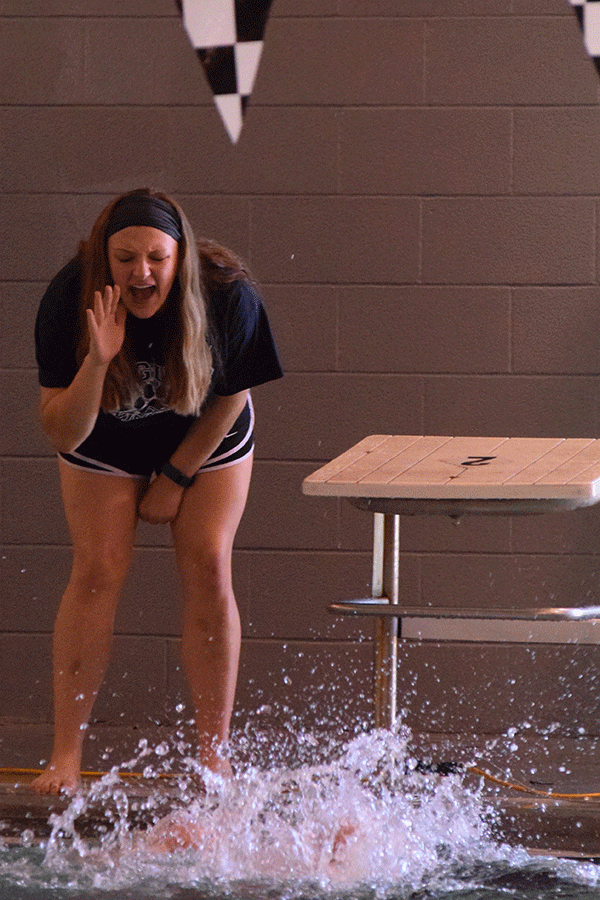 Junior Payton Frye cheers on her teammate.