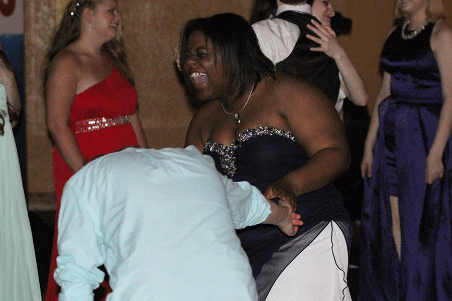 At prom on Sat. April 16, senior Meghan Bicknell laughs as she dances.
