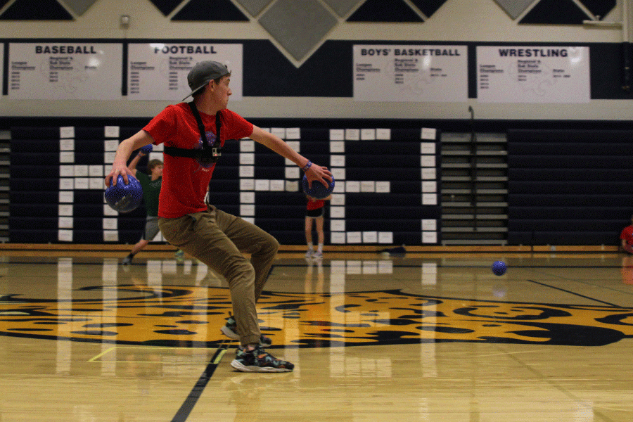 Senior Garret Fields participates in a dodgeball game. 