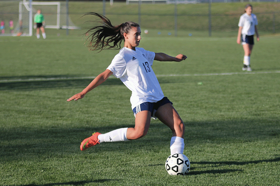 Junior Lauren Moores takes a free kick during the game against Blue Valley on Tuesday, April 12.