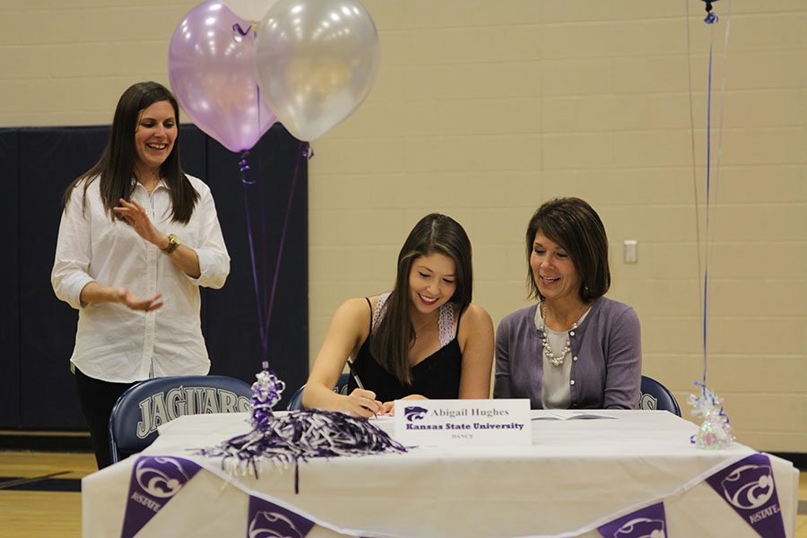 Senior Abigail Hughes signs her letter of intent to dance at Kansas State University