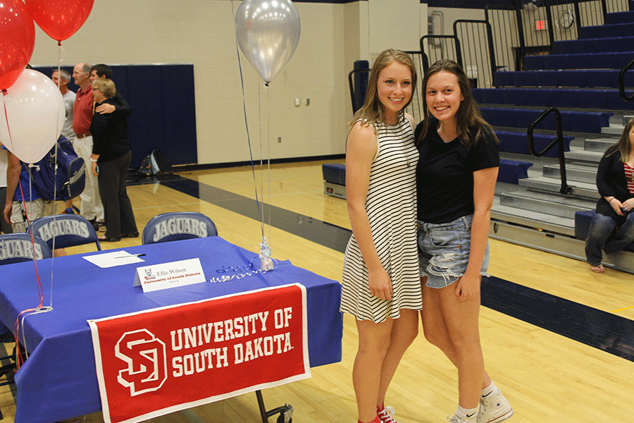 After the signing ceremony, sophopmore Miranda Toland takes a picture with senior signee Ellie Wilson