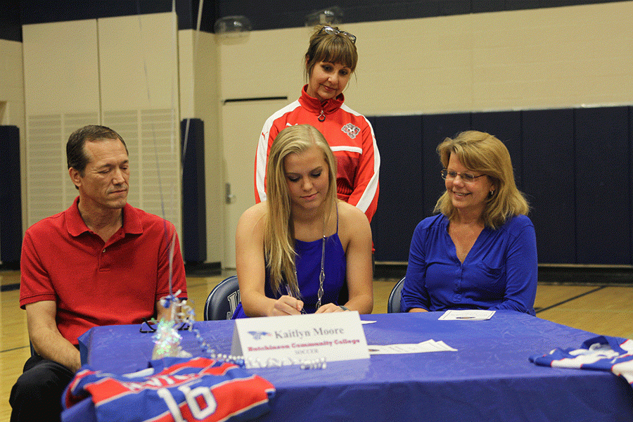 Senior Kaitlyn Moore signs her letter of intent to Hutchinson Community College for soccer