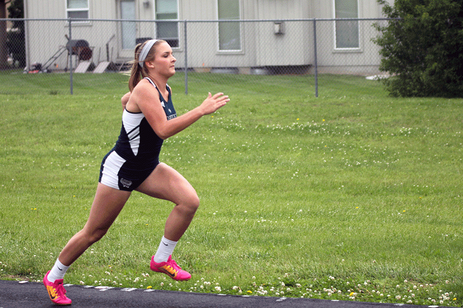 Sophomore Lucy Holland builds up speed before her jumps.