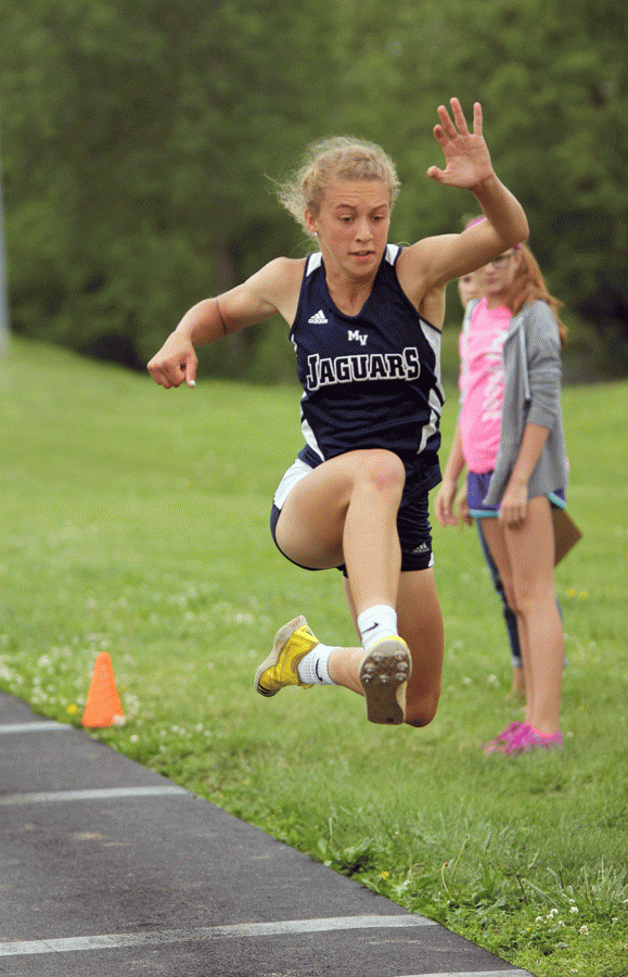 Junior Morgan Thomas prepares to land her third jump in the girls triple jump.