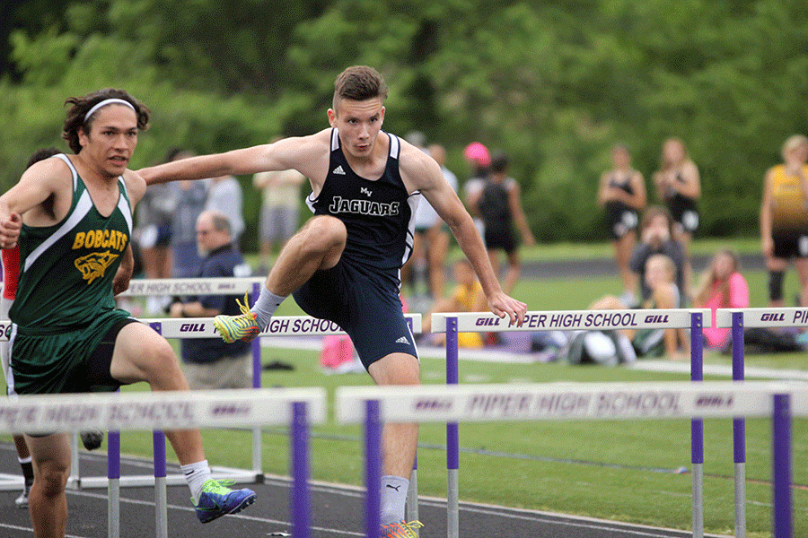 Junior Anthony Meljanac competes in the boys high hurdles.