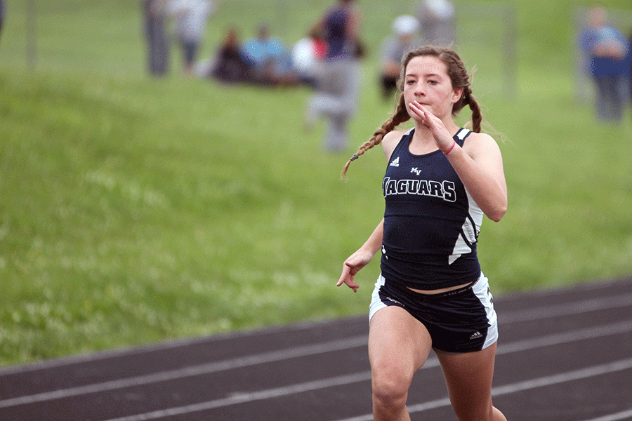 Freshman Lydia McDaneld runs the girls 200 meter sprint.