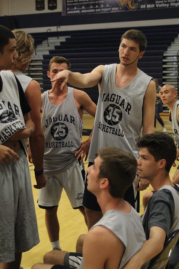 Senior Clayton Holmberg gives pointers during halftime. 