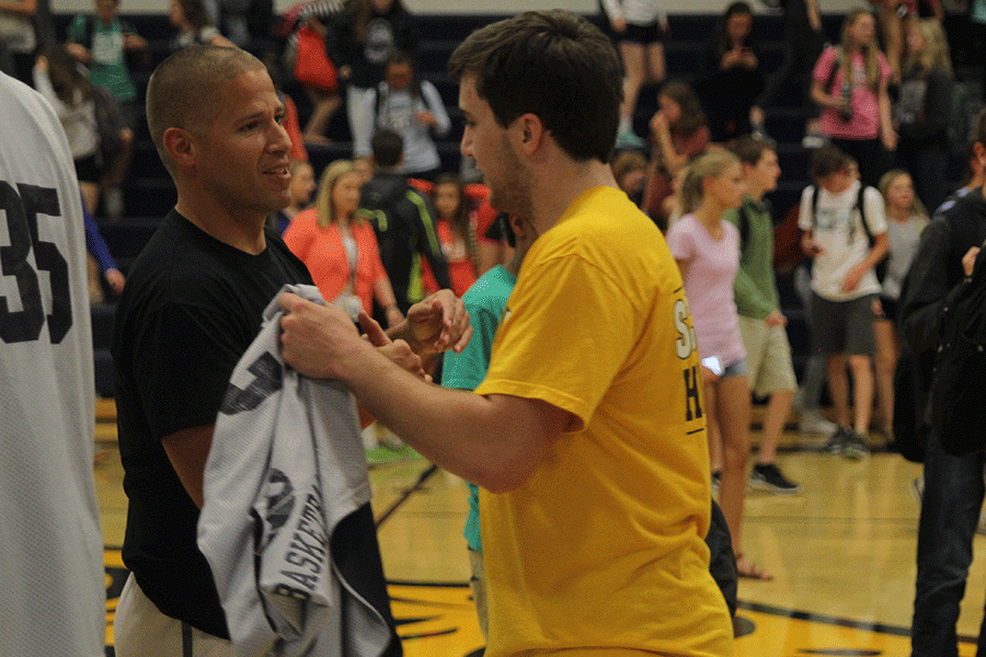 Senior Logan Koch shakes hand with Coach Joel Applebee. 