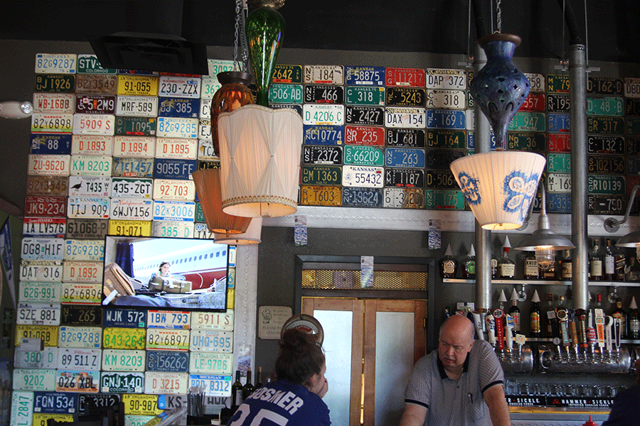 The bar area of Knub's Pub has a glow feature, adding spice during a late night rush. The license plates and upside down lamps bring a unique quality to Knub's Pub's style.