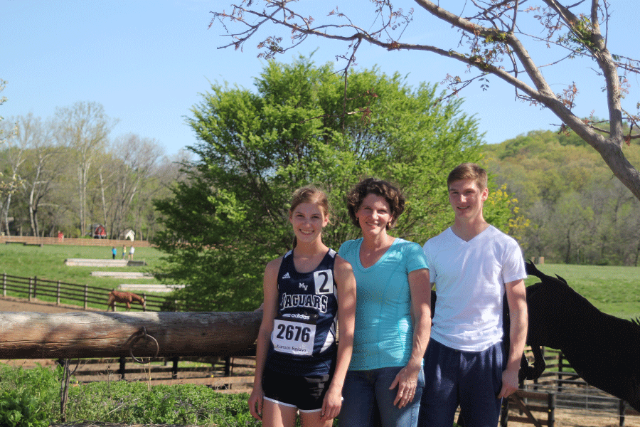 The Nelson family stands in front of scenery at Twin Mill Farm on Saturday, April 23.