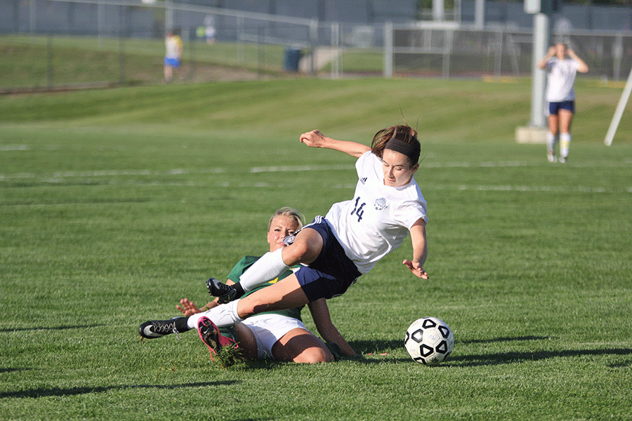 Senior Kennedy Hoffman is knocked off of her feet by an opponent from Basehor-Linwood on Tuesday, May 3. The Jaguars won 8-1. 