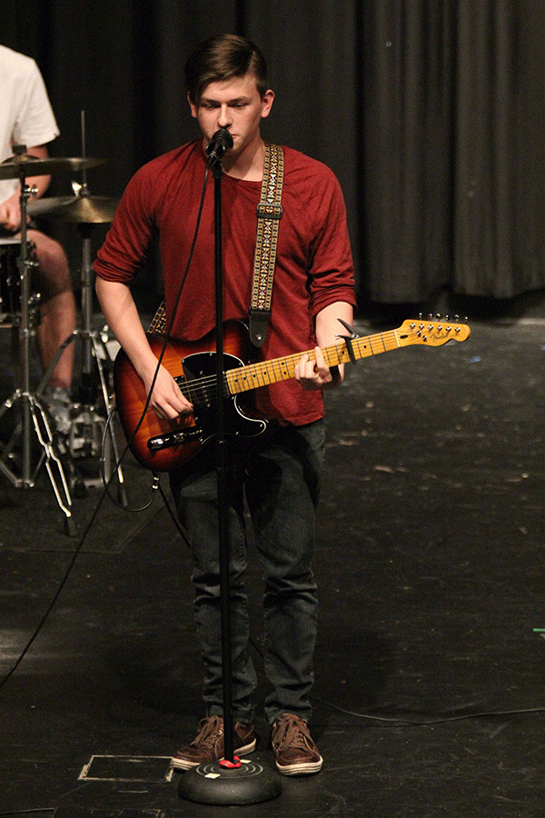 Junior Brady Herron sings an original song along with his band.