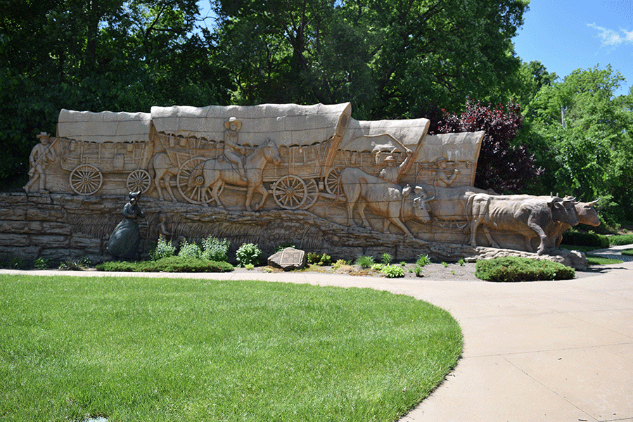 Pioneer Crossings Park includes several large statues. 