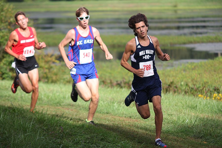 Junior Gavin Overbeck leads the team in the beginning of the five kilometer race.