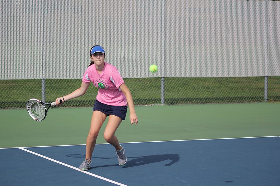 Junior Tori Benson prepares to hit the ball back to her opponent. 
